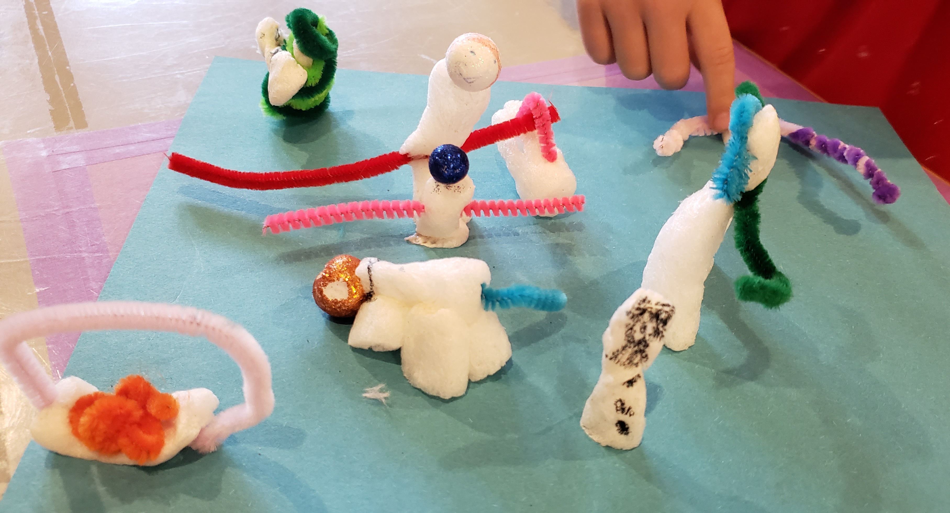 Photo. A small collection of handmade critters made of styrofoam and pipe-cleaners.